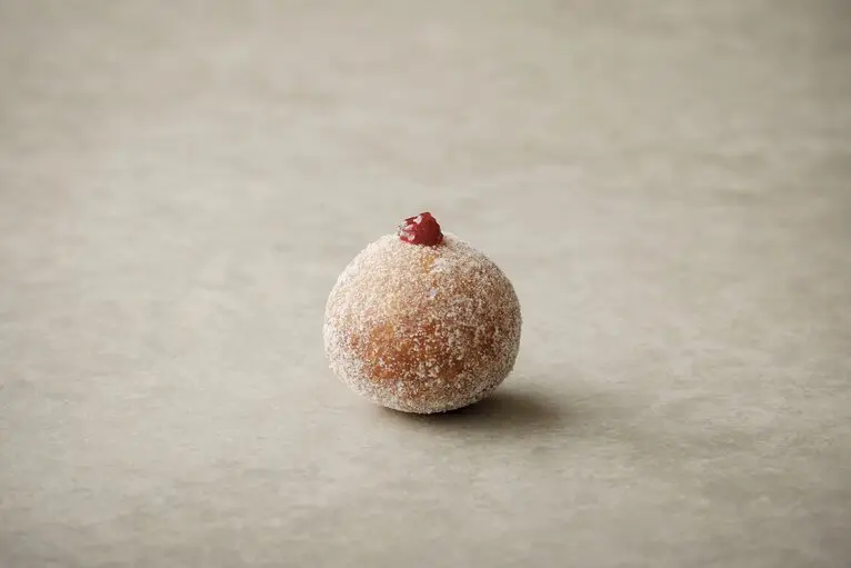 Bomboloni pastry dusted with sugar at Aman Tokyo.