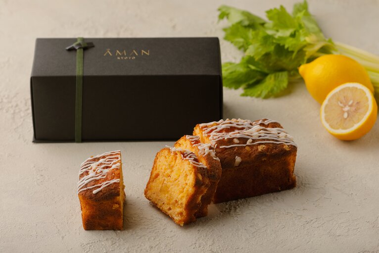 Sliced lemon pound cake at Aman Kyoto with fresh lemon and herbs.