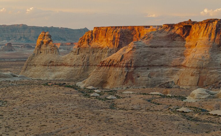 Desert rock formations bathed in golden light at Amangiri, Utah.