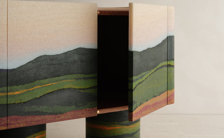 Fernando Mastrangelo's sculptural artwork featuring layered landscape imagery and geometric black form at Aman New York.