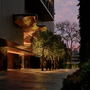 Aman Nai Lert Bangkok exterior at dusk, featuring illuminated architectural elements and landscaped greenery.