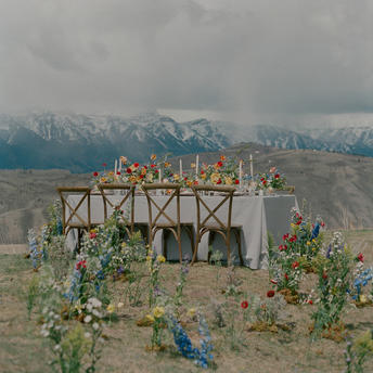 Wooden wedding arch decorated with greenery in a mountain valley at Amangani.