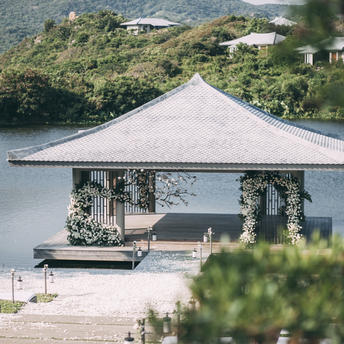 Amanoi pavilion with peaked roof overlooking Lotus Lake, Vietnam.