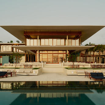 Casa Grande exterior at Amanera, with modernist architecture and reflecting pool.
