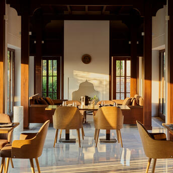 Amanruya's sushi restaurant with wooden tables, warm lighting, and minimalist décor.