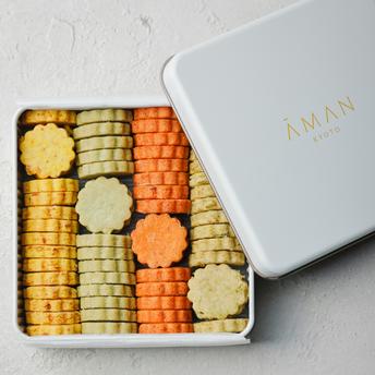 Aman Kyoto vegetable sablé selection in white box with assorted biscuits arranged in rows.