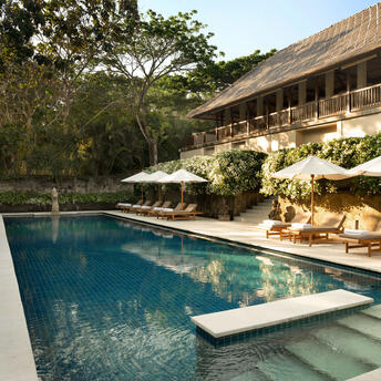 Swimming pool with lounge area at Aman Villas at Nusa Dua, Bali.