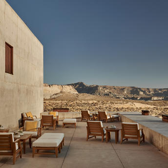 Terrace lounge at Amangiri resort overlooking desert landscape and mountains.
