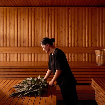 Visitor relaxing in the wooden banya at Amanoi, Vietnam's Forest Wellness Pool Villa.