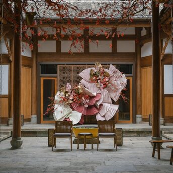 Red lanterns and floral decorations adorning a traditional Chinese pavilion at Amanyangyun during celebrations.