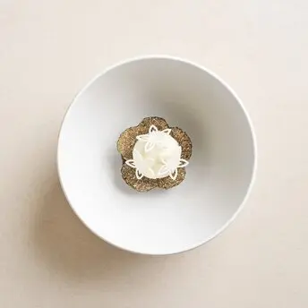 Daechu dessert in white bowl at Aman Tokyo hotel, photographed from above.