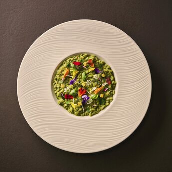 Pea risotto with crispy guanciale at Aman Tokyo's dining venue, Arva Erbosteria.