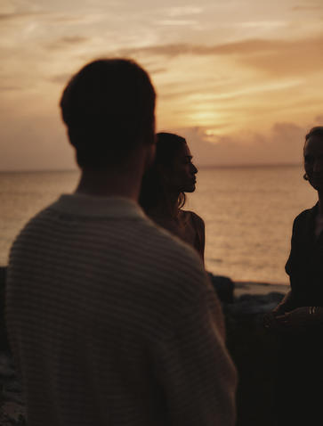 People gathered for a summer sunset at Amanyara