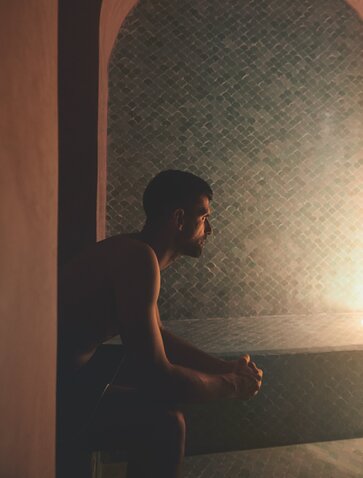 Novak Djokovic gazes out from a sunlit window at Amanjena, Morocco.